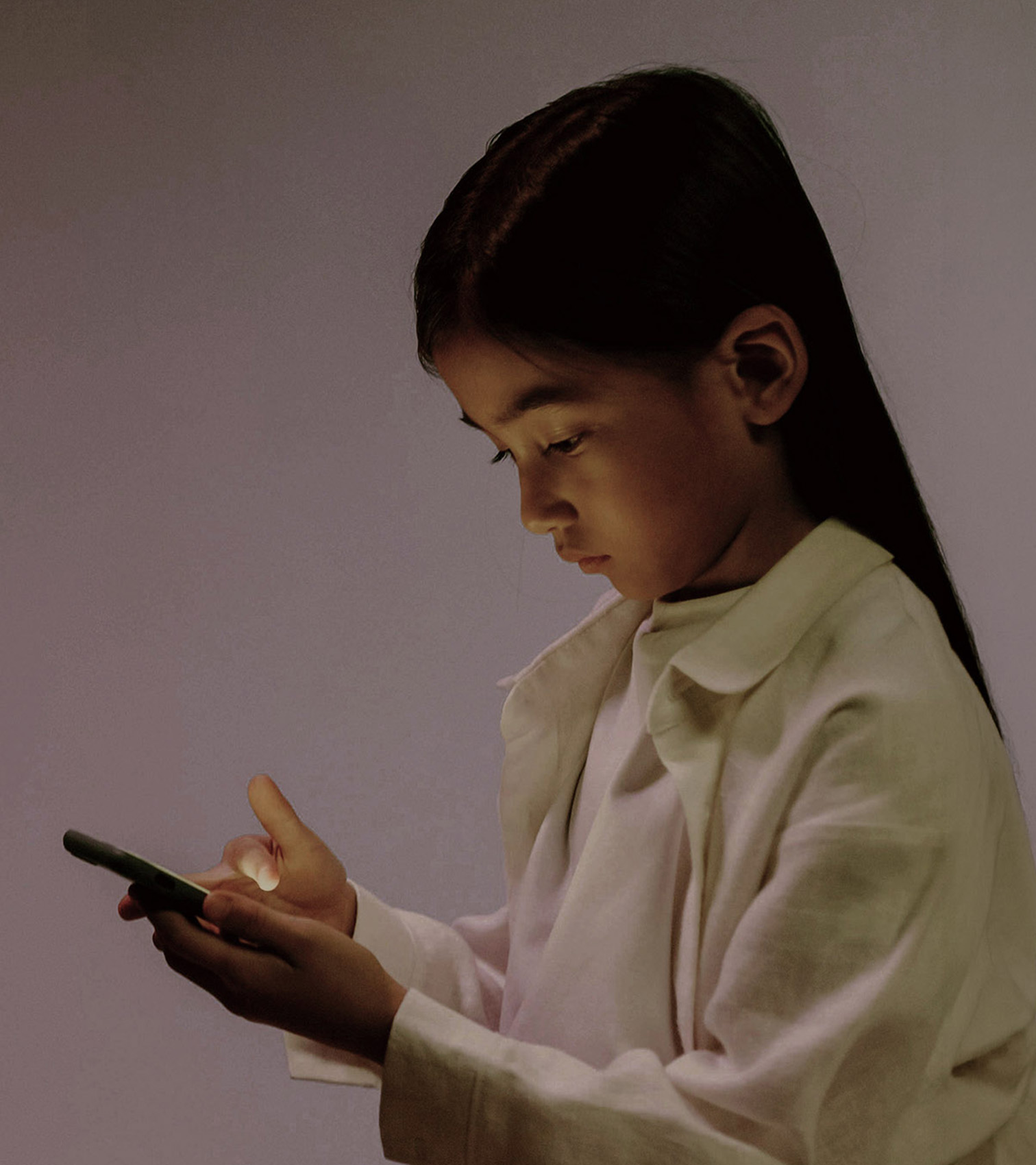 Global Freedom Summit 2026. Girl holding up phone